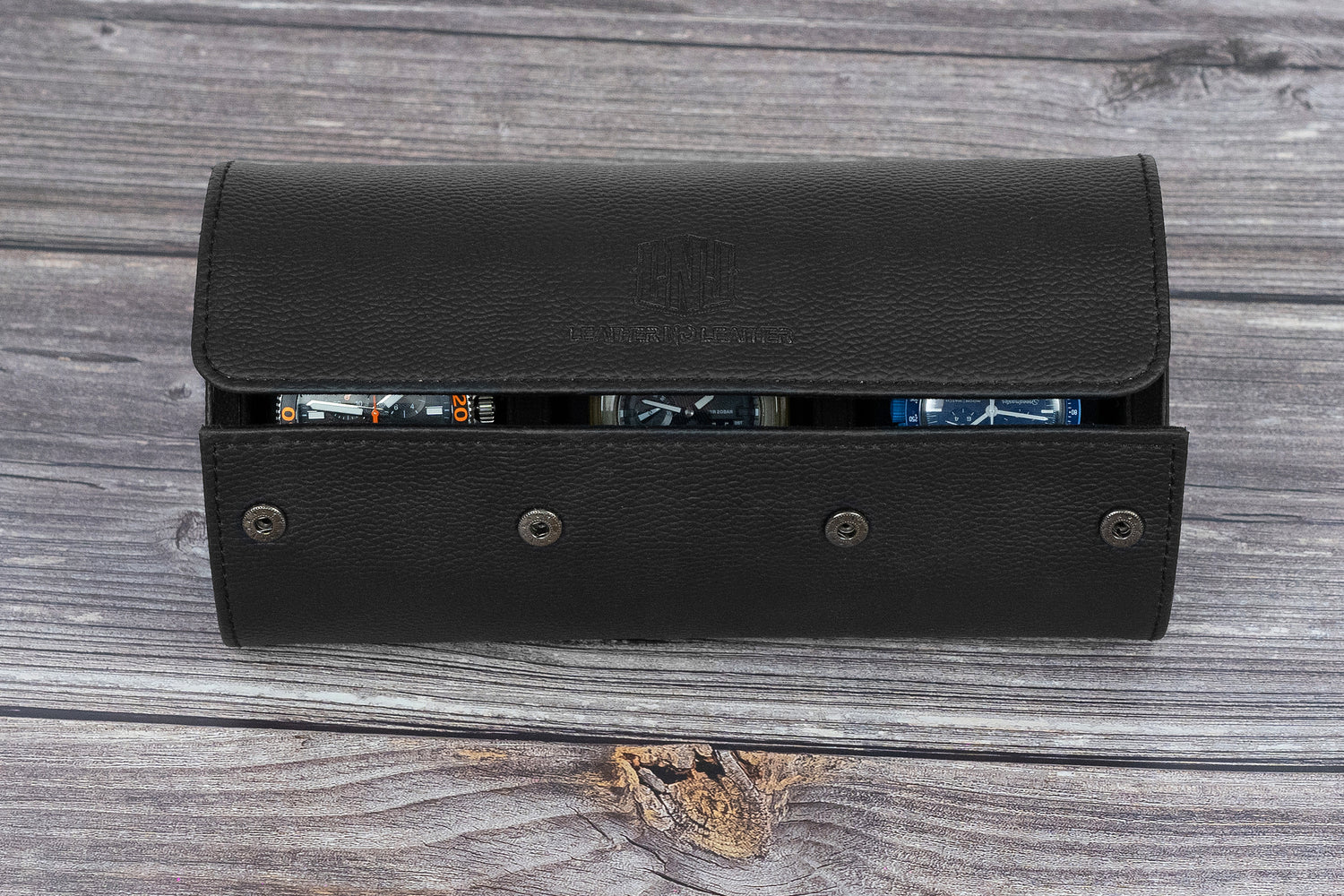Black leather wallet open on a wooden surface