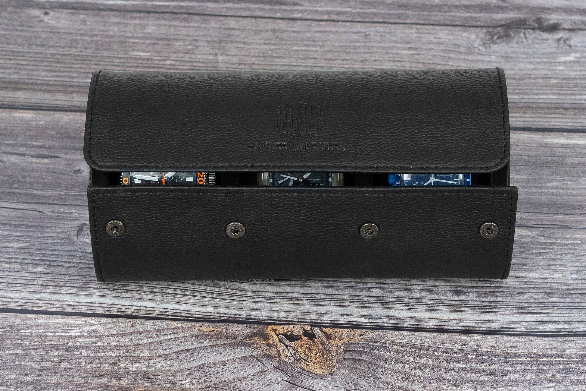 Black leather wallet open on a wooden surface